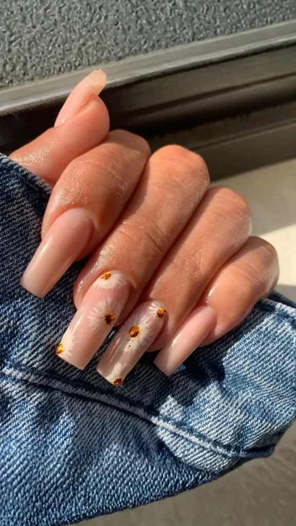 Long nude spring nails with delicate white cherry blossom floral art