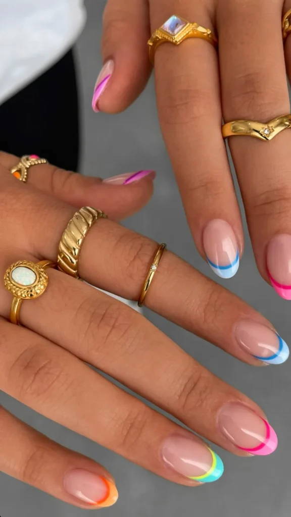 Elegant nude and white floral spring nails with delicate branch designs on coffin shape