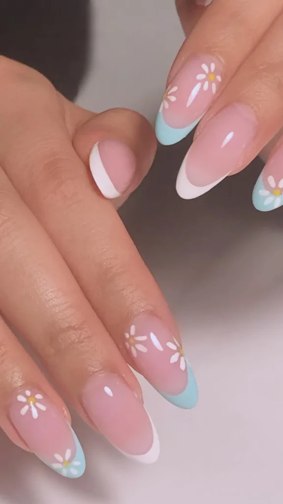 Purple daisy French tip spring nails with white and yellow flowers on long almond shape