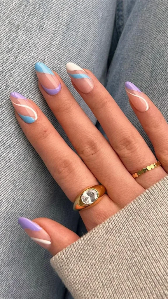 Colorful dotted floral spring nails on short square pastel manicure