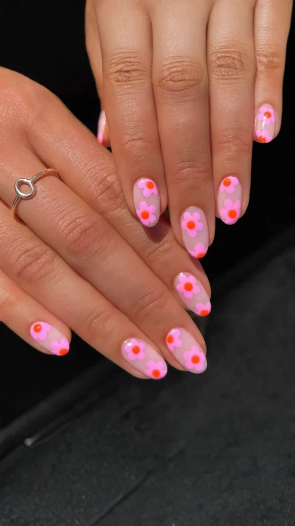 Soft pastel daisy spring nails in blue pink yellow and nude shades