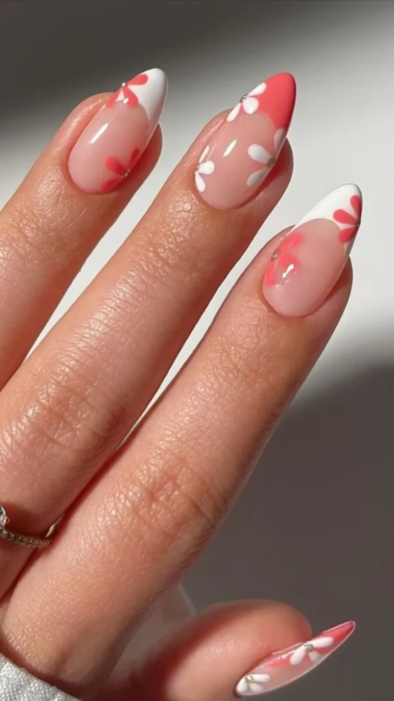 Coral and sky blue short spring nails with delicate gold foil floral accents